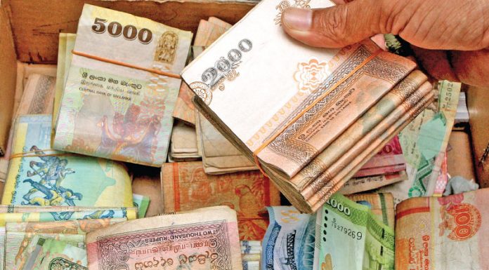 Sri Lanka rupee hovers near record low amid continued political uncertainty